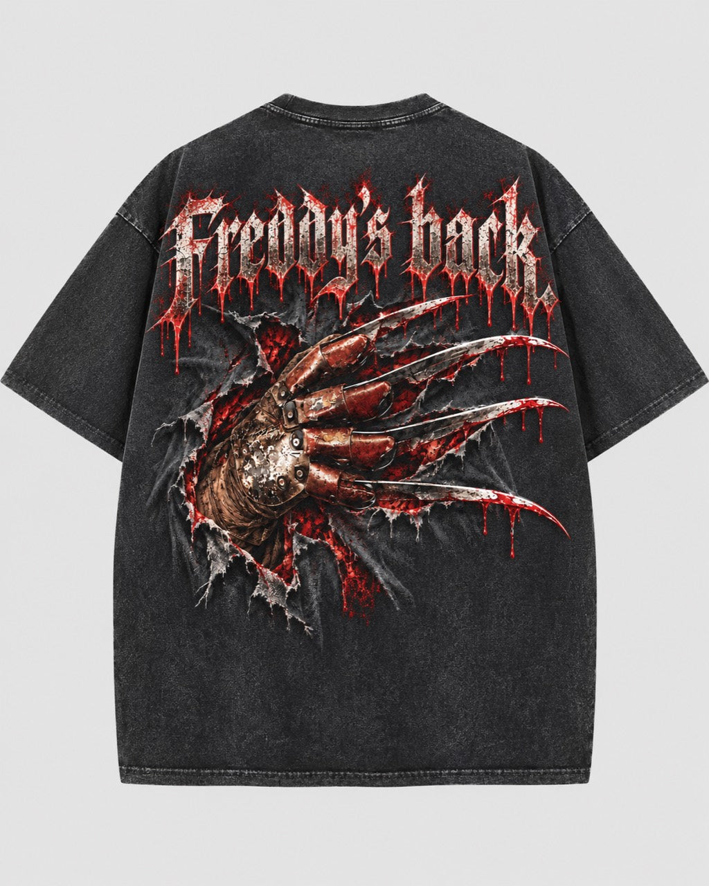 Back of a washed dark T-shirt featuring “Freddy’s back” lettering and a bladed glove breaking through a torn-effect graphic.