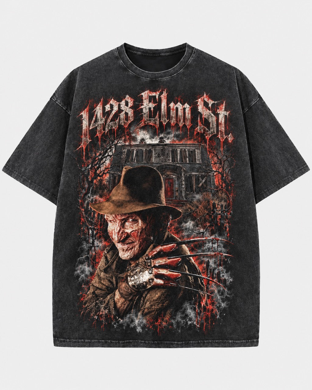 Front of a washed dark T-shirt featuring Freddy with a bladed glove, a dark house, and “1428 Elm St” lettering.