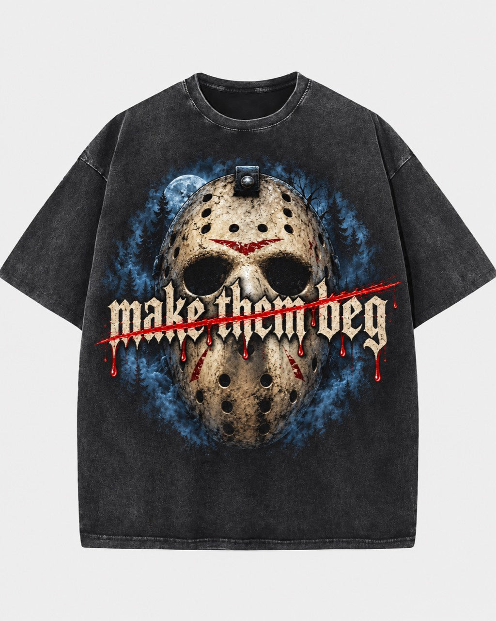 Front of a washed dark T-shirt featuring a hockey mask, blue forest scene, and “Make Them Beg” lettering with a red slash.